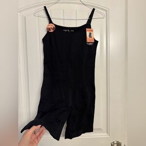 One black mid thigh bodysuit
